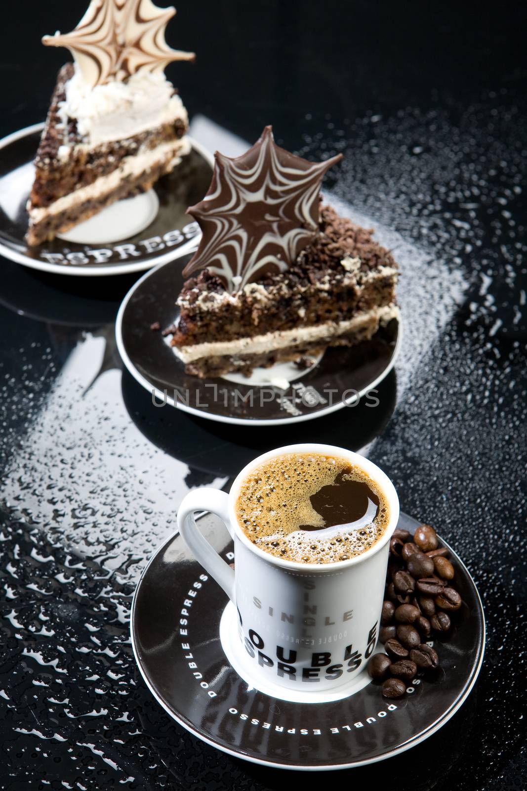 Coffee and chocolate cake on a glass background