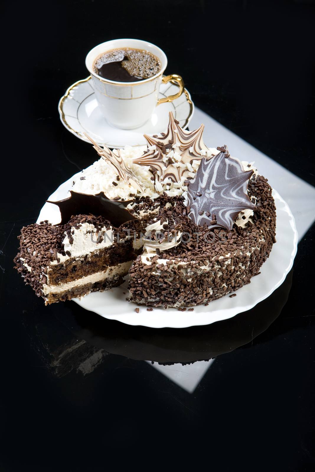 Coffee and chocolate cake on a glass background