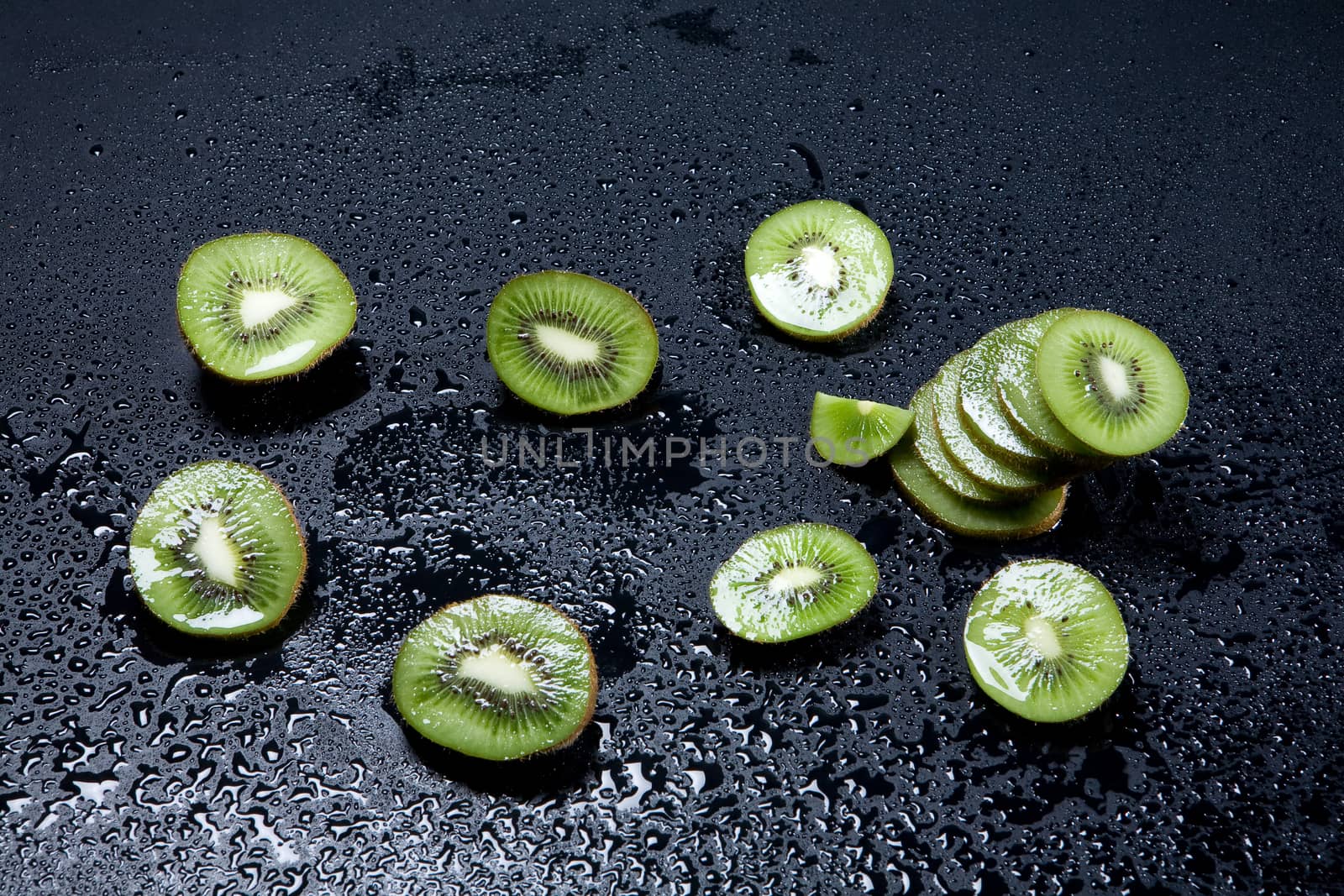 Pieces of kiwi on white background