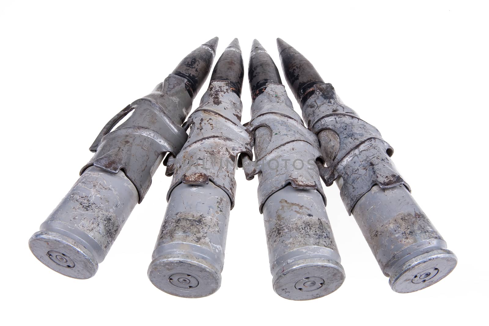 Cartridges for big caliber machinegun on isolated background