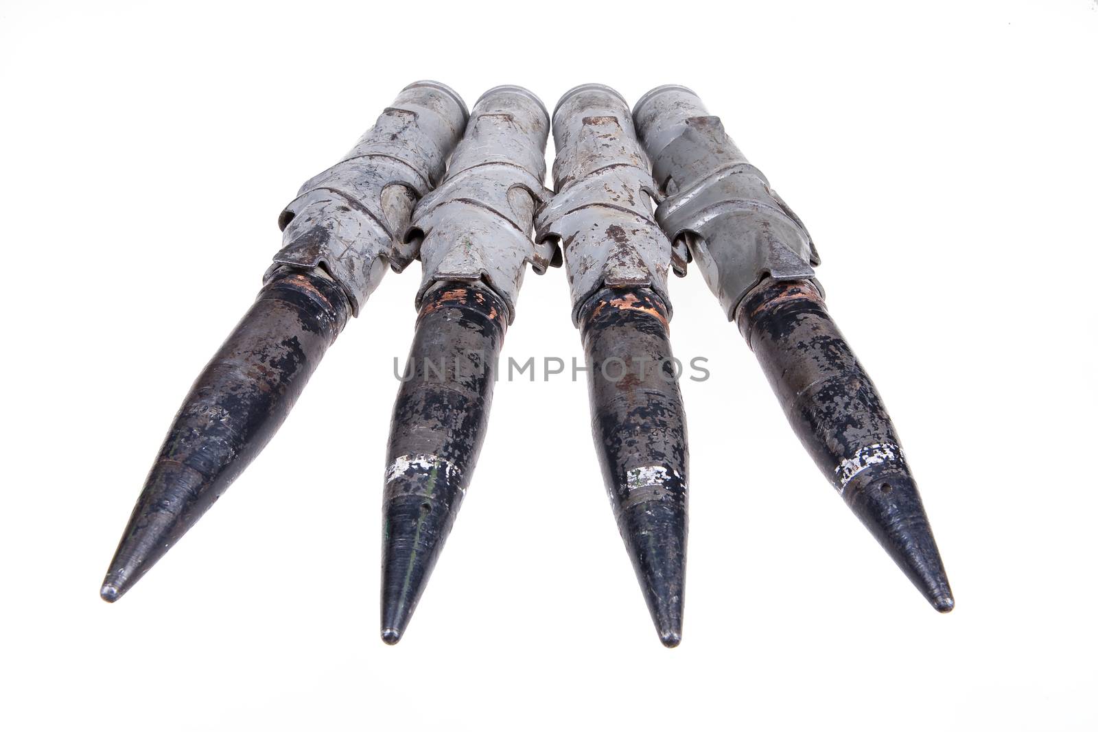Cartridges for big caliber machinegun on isolated background