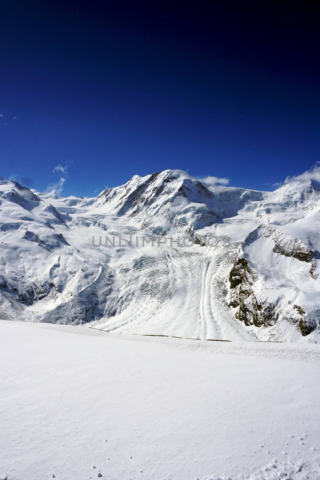 snow alps mountains vertical and blue sky, zermatt, switzerland