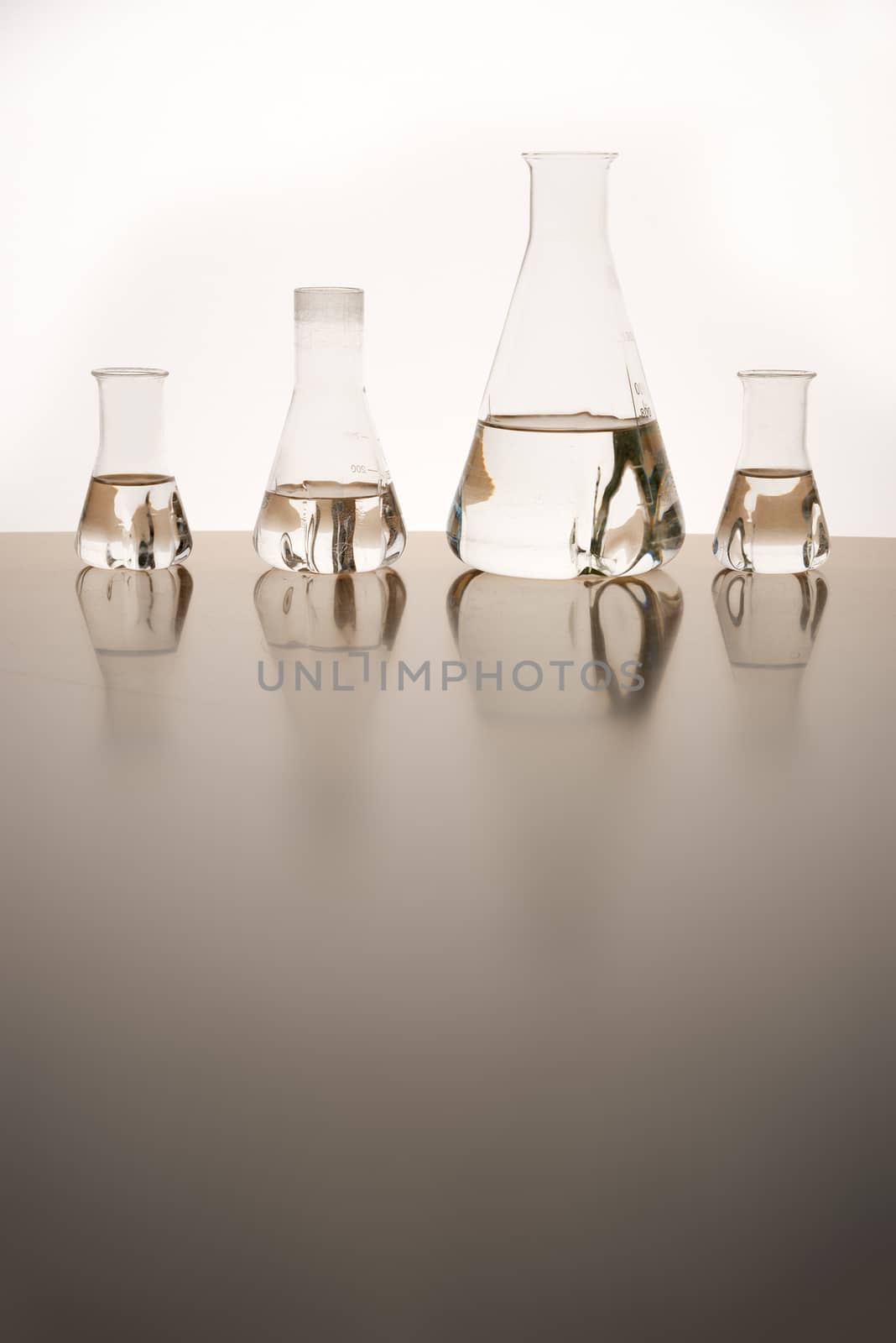 Measuring glasses on a table of a chemical laboratory and free space