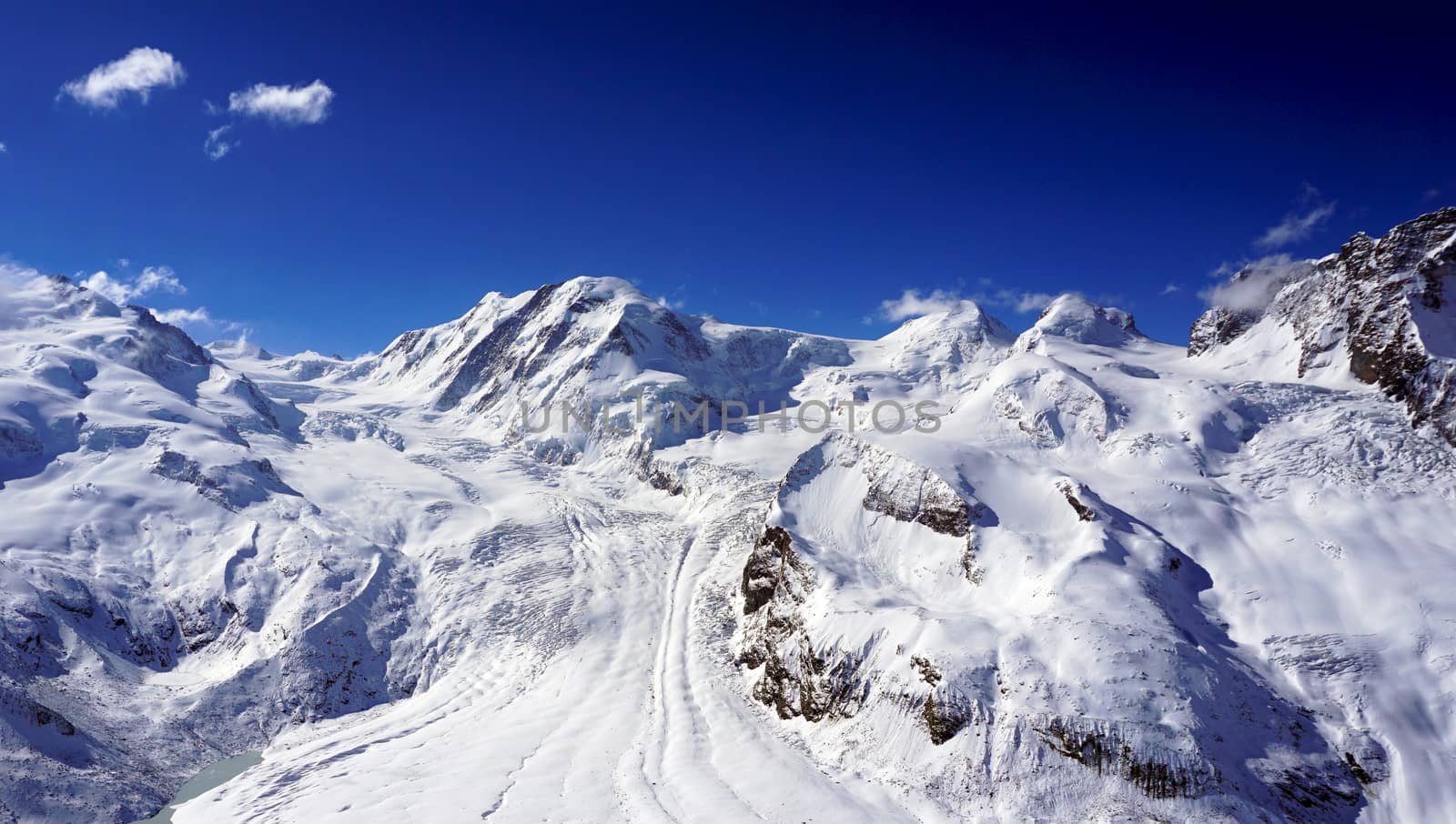 snow alps mountains with clouds, zermatt, switzerland