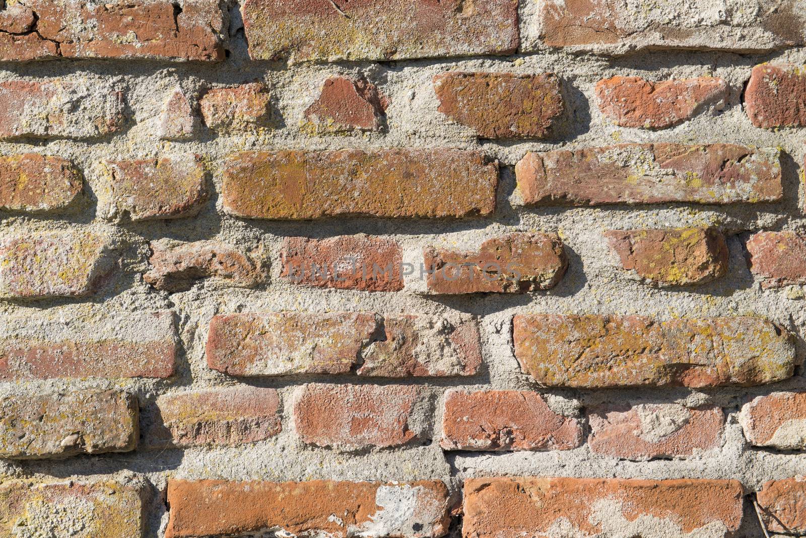 Background, old masonry brick wall in Winterswijk in the Netherlands
