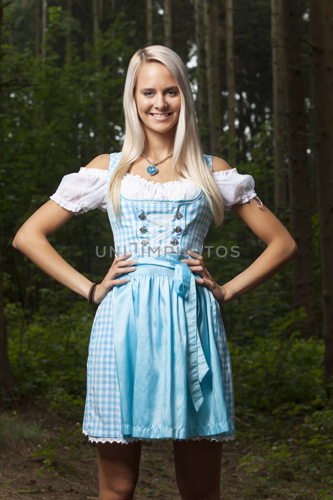 blonde woman in a bavarian dirndl by bernjuer