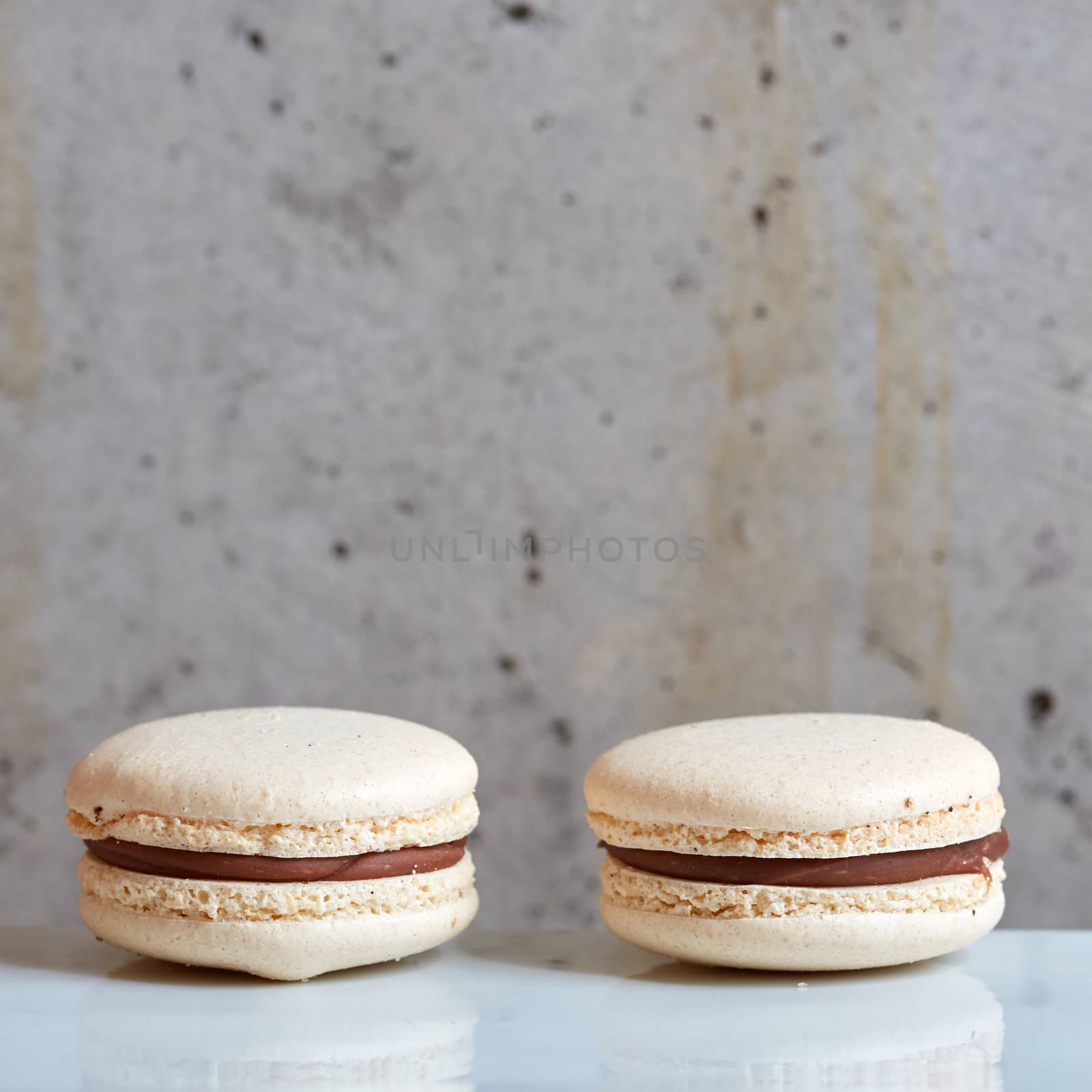 Sweet handmade macaroon on grey background. Shallow dof