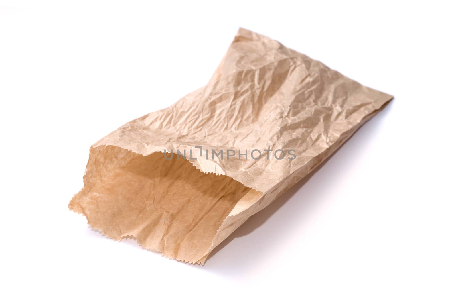 Brown paper bag isolated on white by DNKSTUDIO