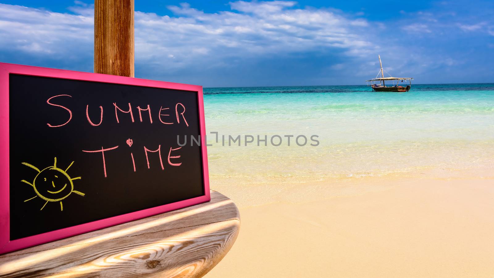 In the picture a Zanzibar beach which is a small blackboard with the words " Summer Time " in the afternoon .