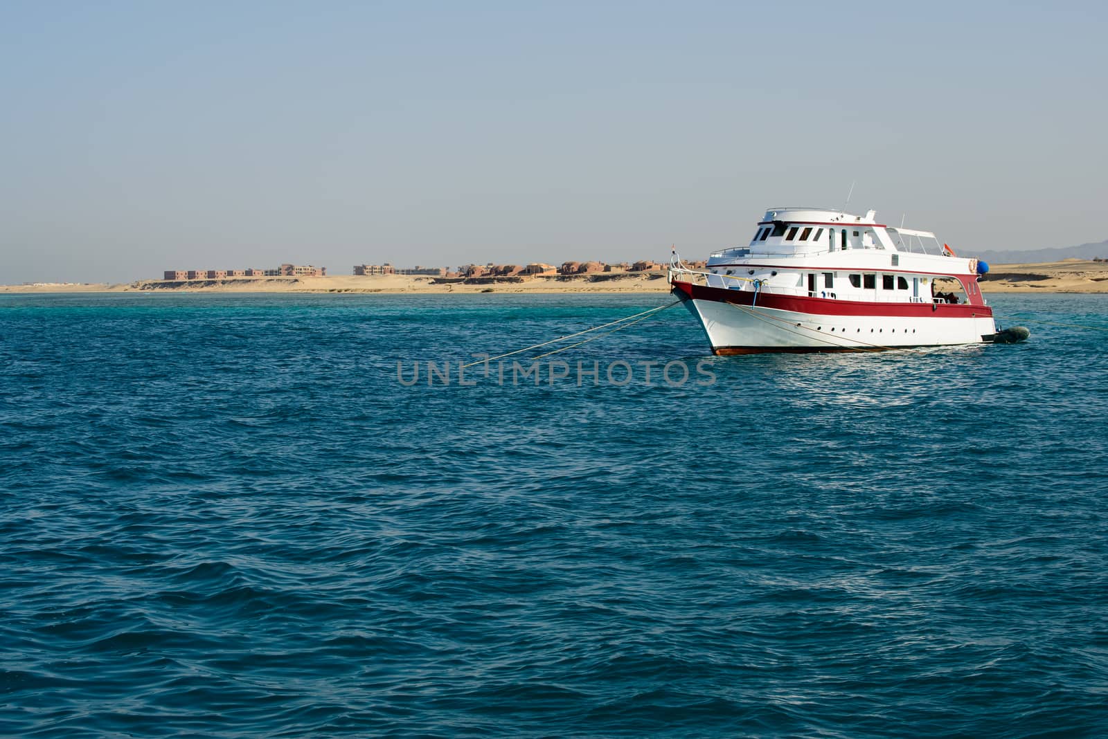 In the picture a yacht anchored near the port of Hamata , Egypt Red Sea