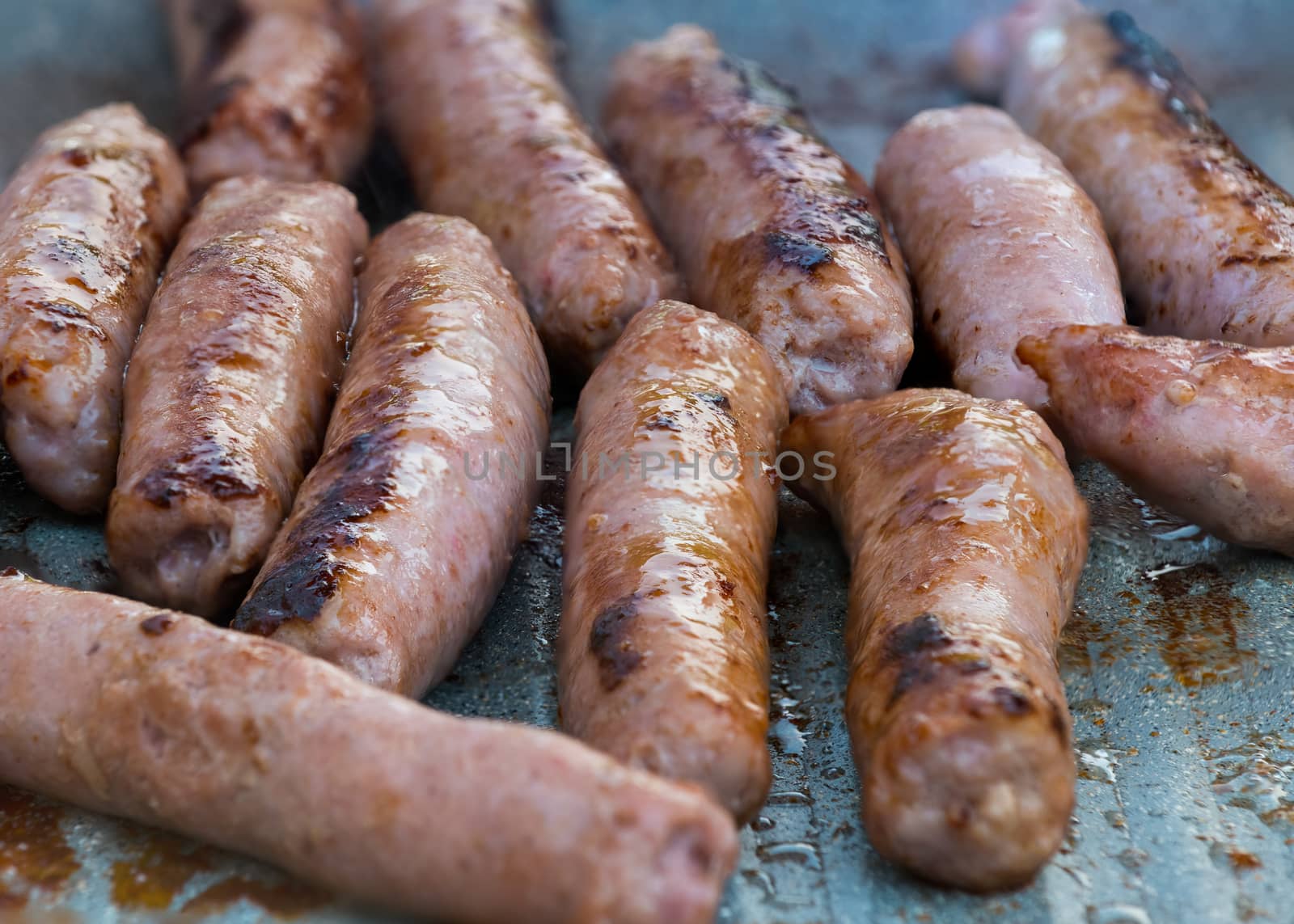 Cooking sausages close-up by Robertobinetti70