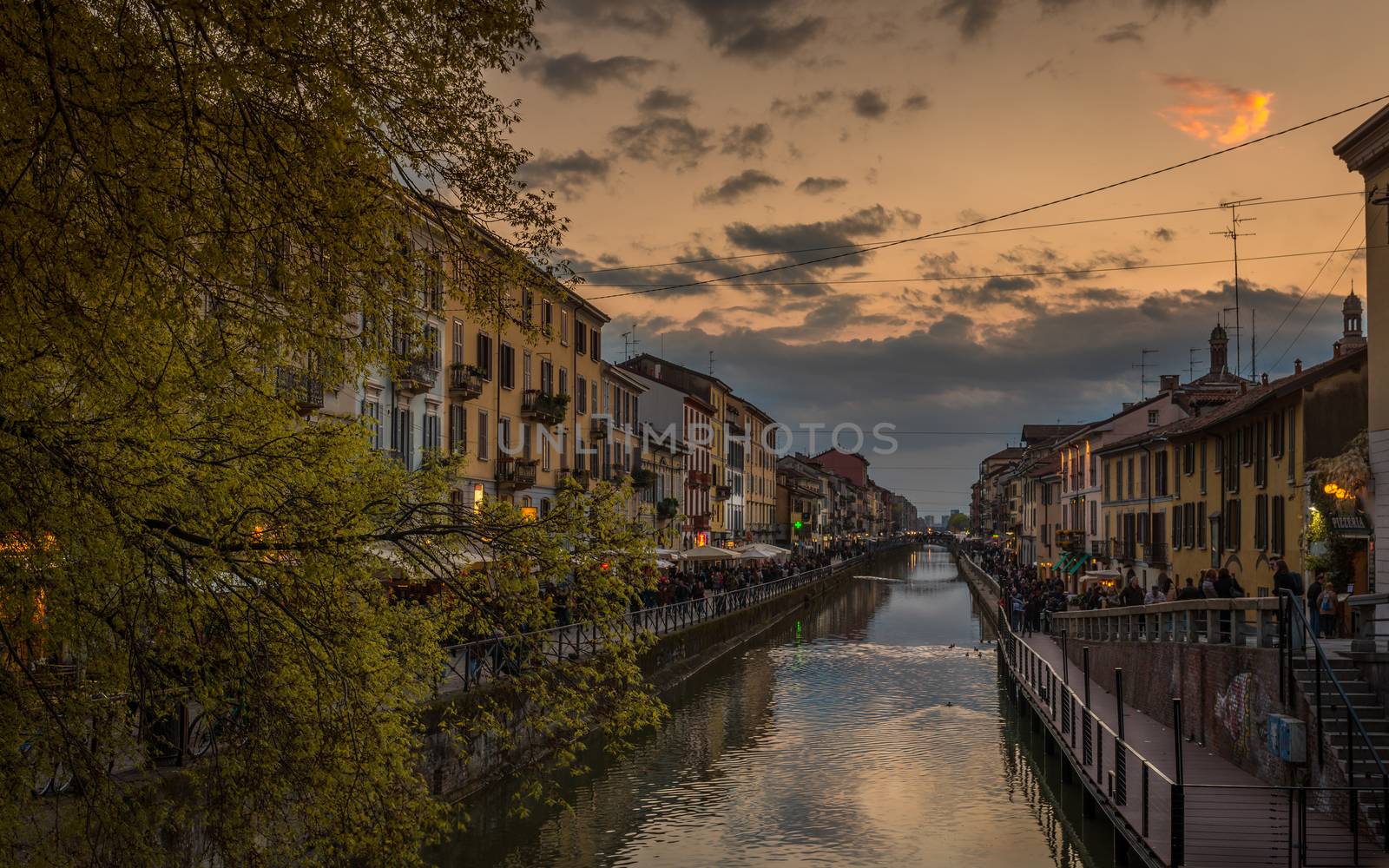 Pictured the canals in Milan "Navigli milanesi" where thousands of people every night they go for a drink or a simple walk .