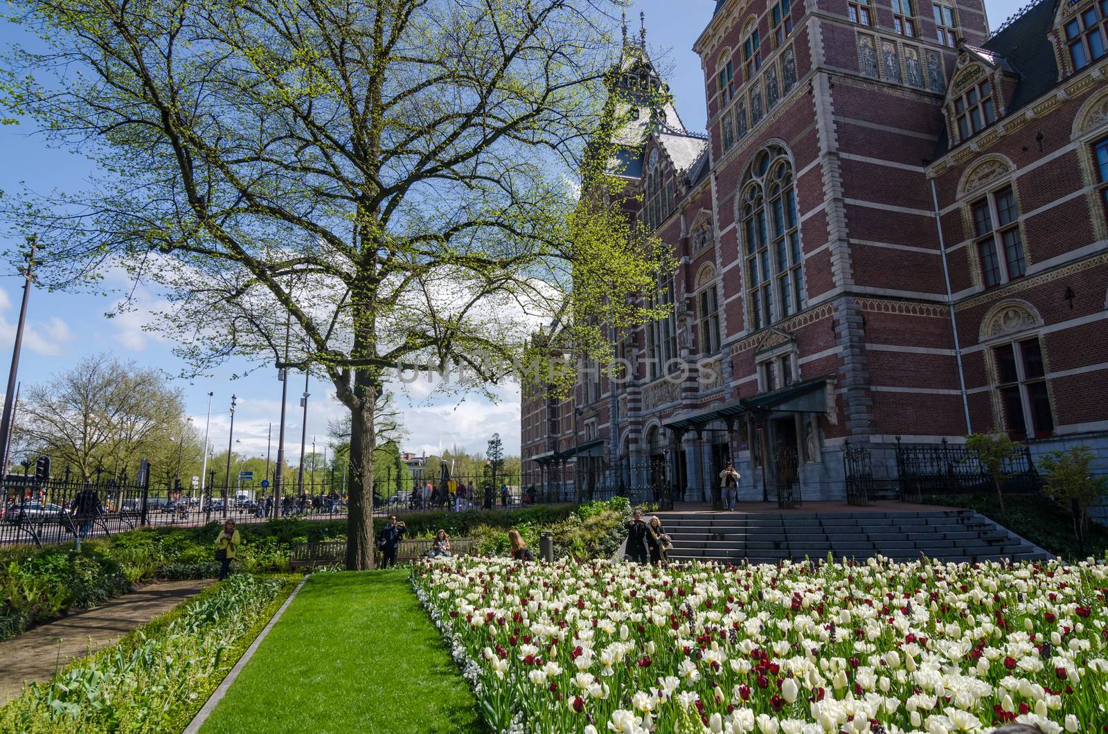 Amsterdam, Netherlands - May 6, 2015: Tourists at the garden around the Rijksmuseum. by siraanamwong