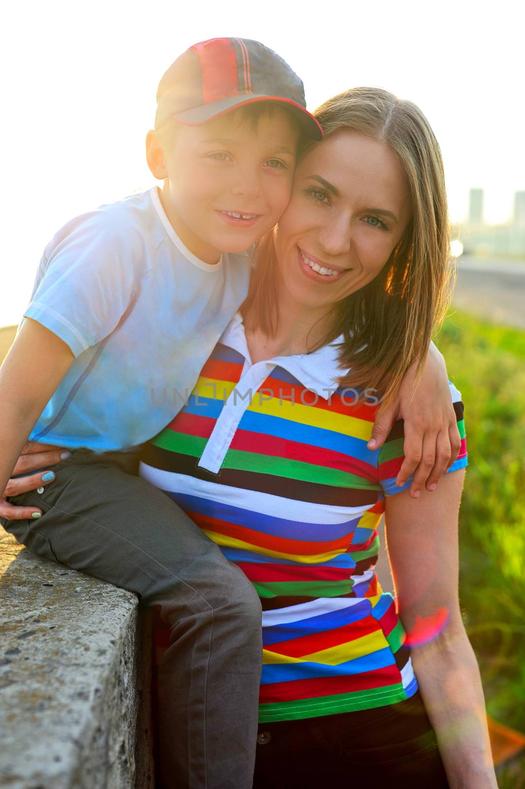 woman with her son on sunrise