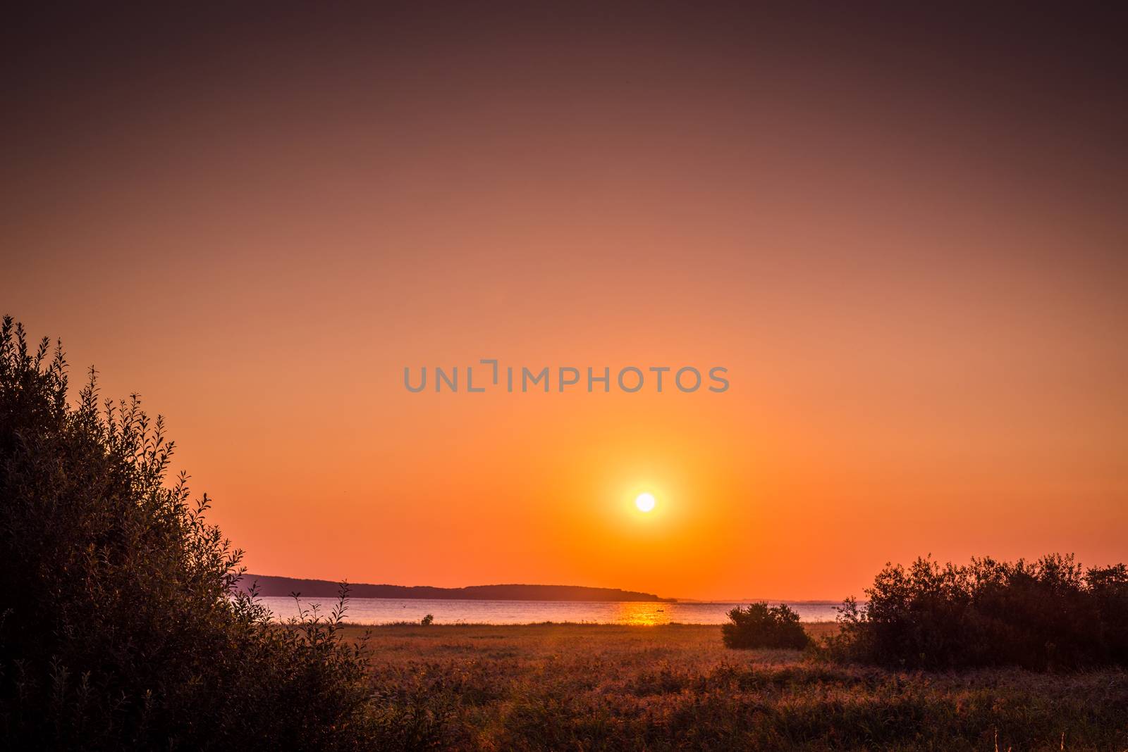 Countryside lake with a sunrise in the late summer