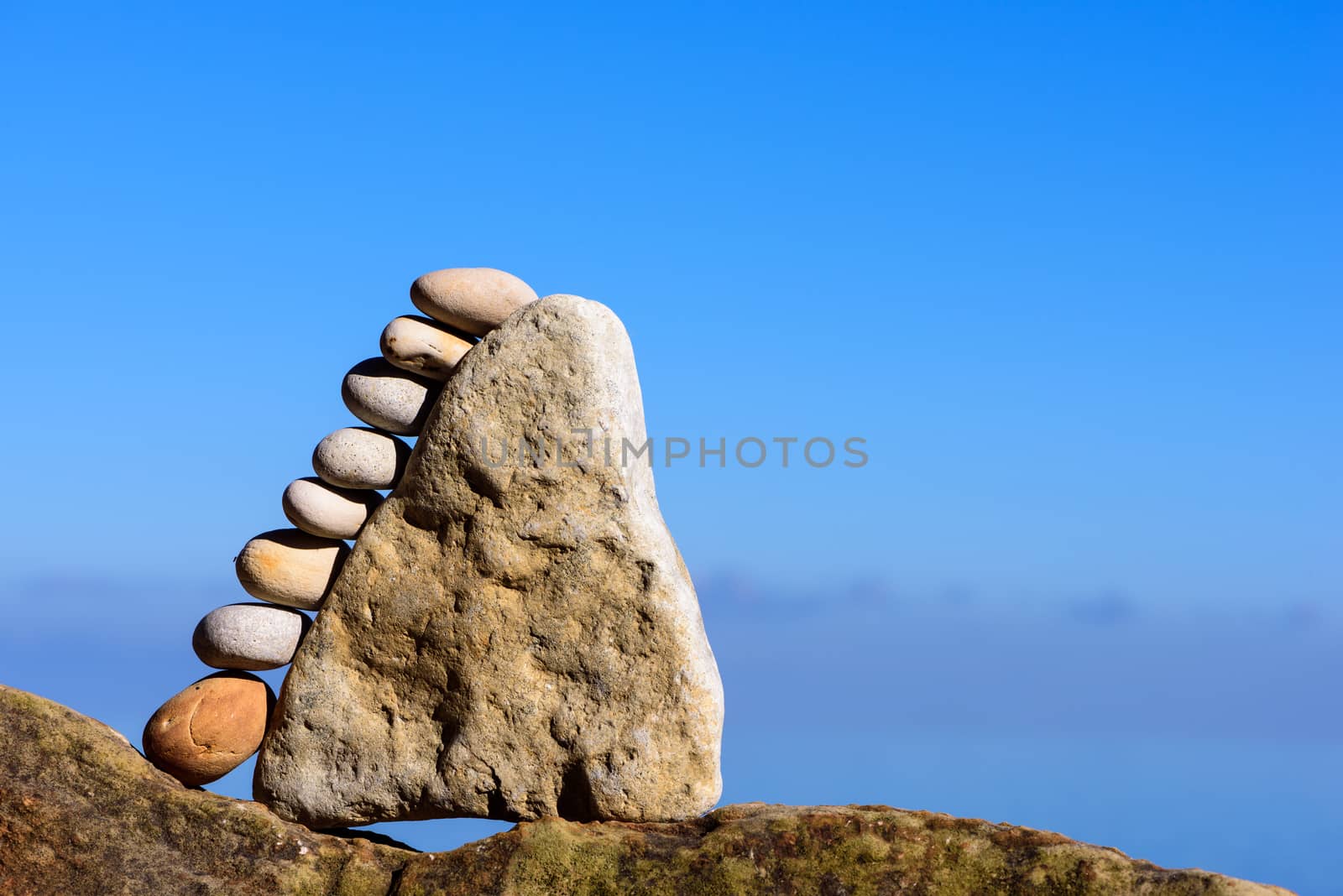 Balancing of pebbles each other on the stone