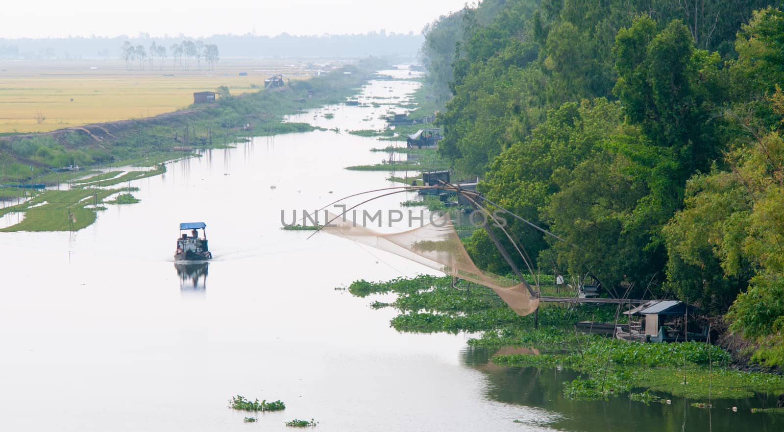 Cargo boat floating on the Mekong river, southern Vietnam.