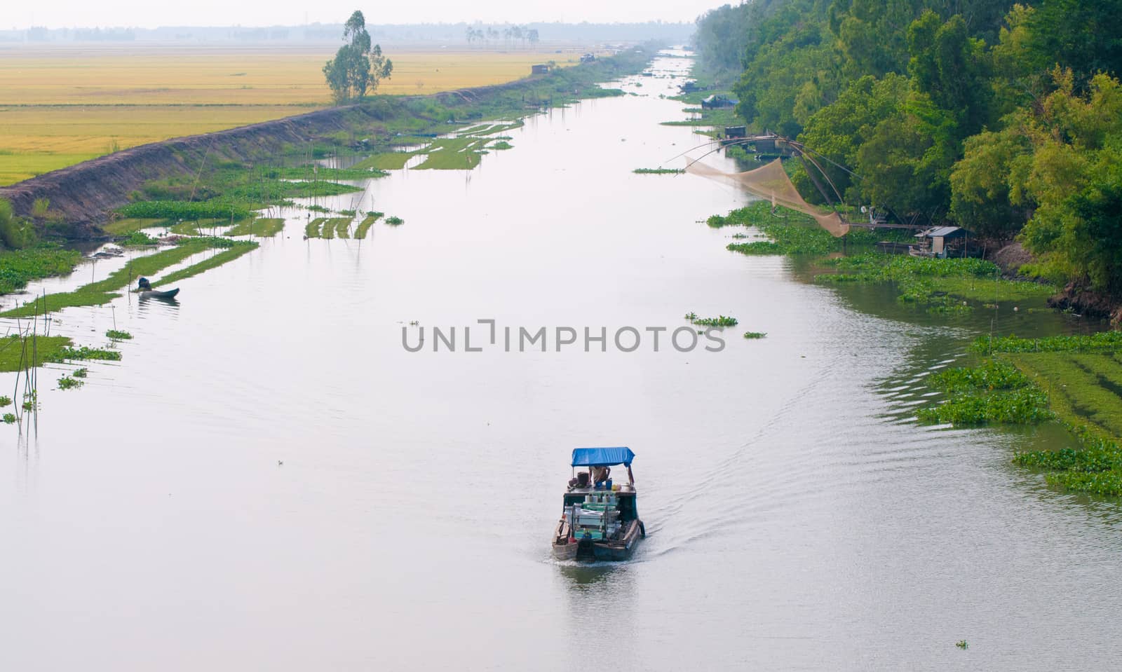 Cargo boat floating on the Mekong river by vietimages