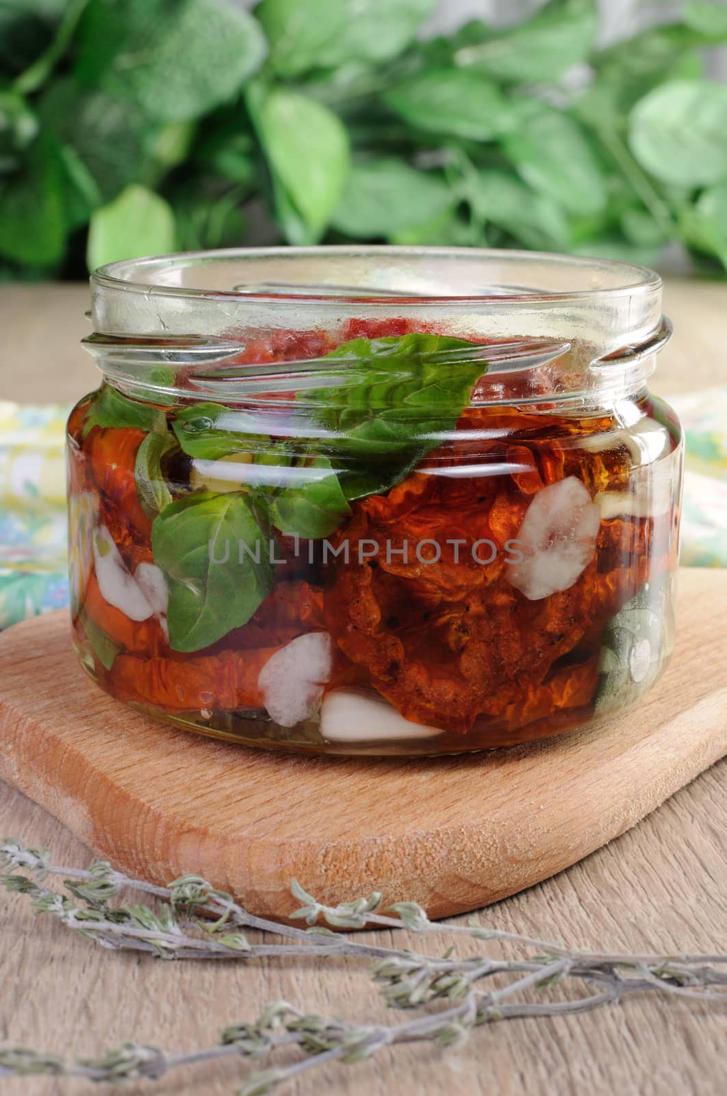 Slices of dried tomatoes with garlic and basil oil