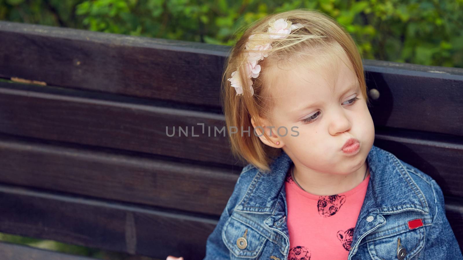 Portrait of funny little child, adorable blonde toddler girl  by sarymsakov