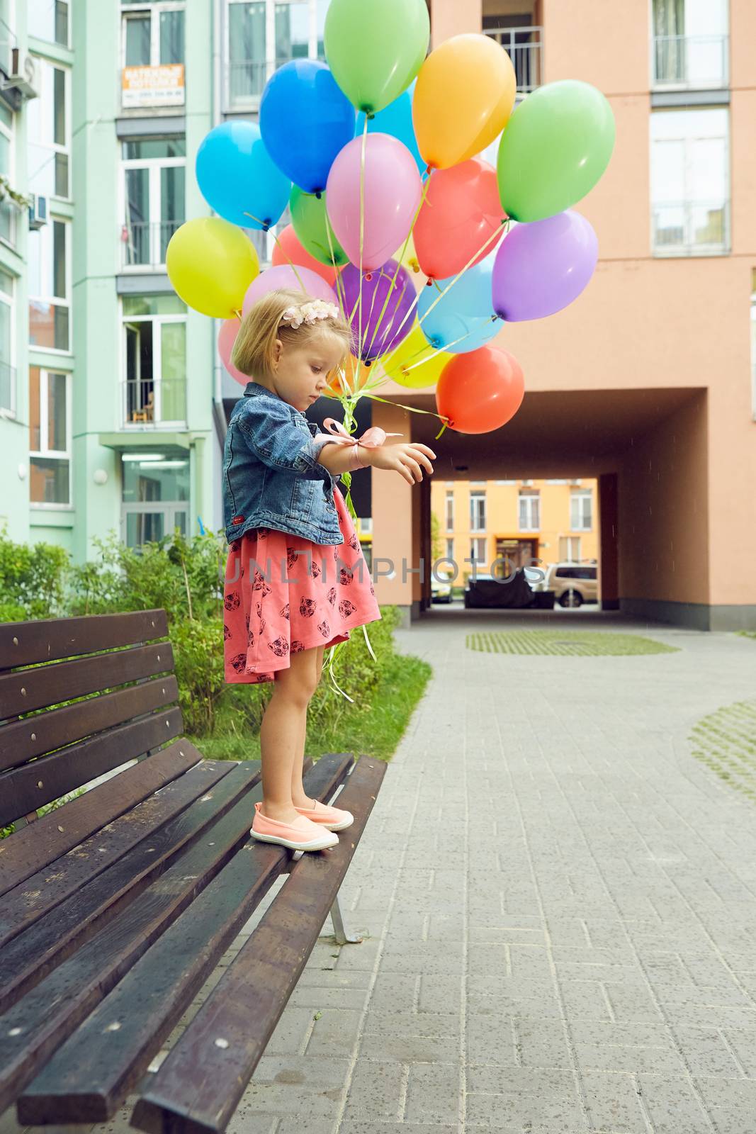 inspiration, happy little girl outdoors with balloons