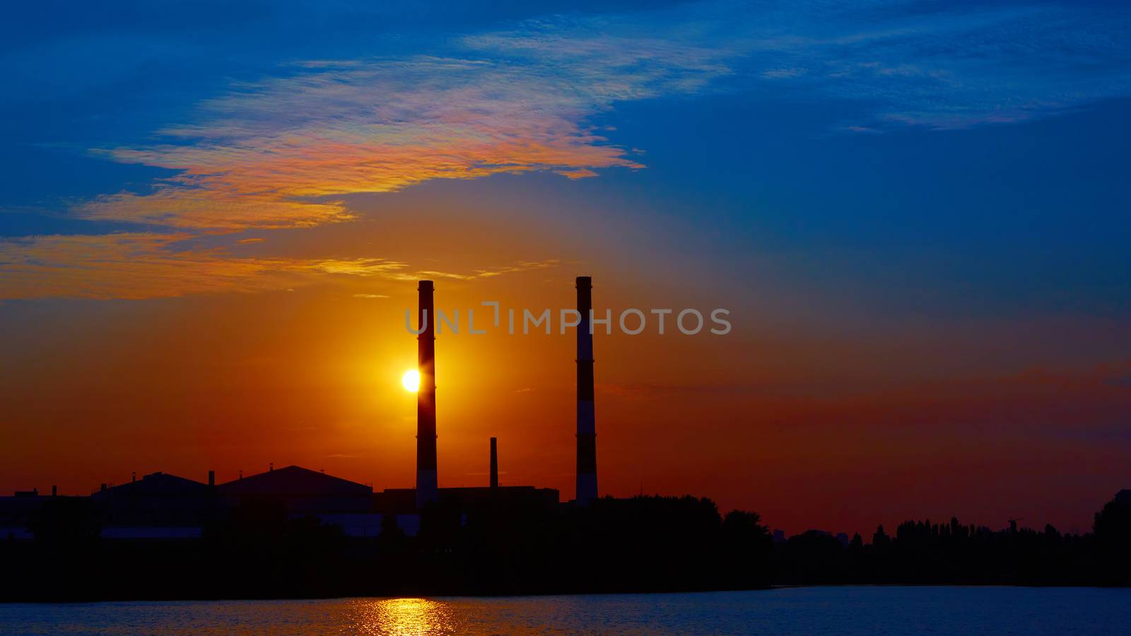 factory in silhouette and sunrise sky by sarymsakov