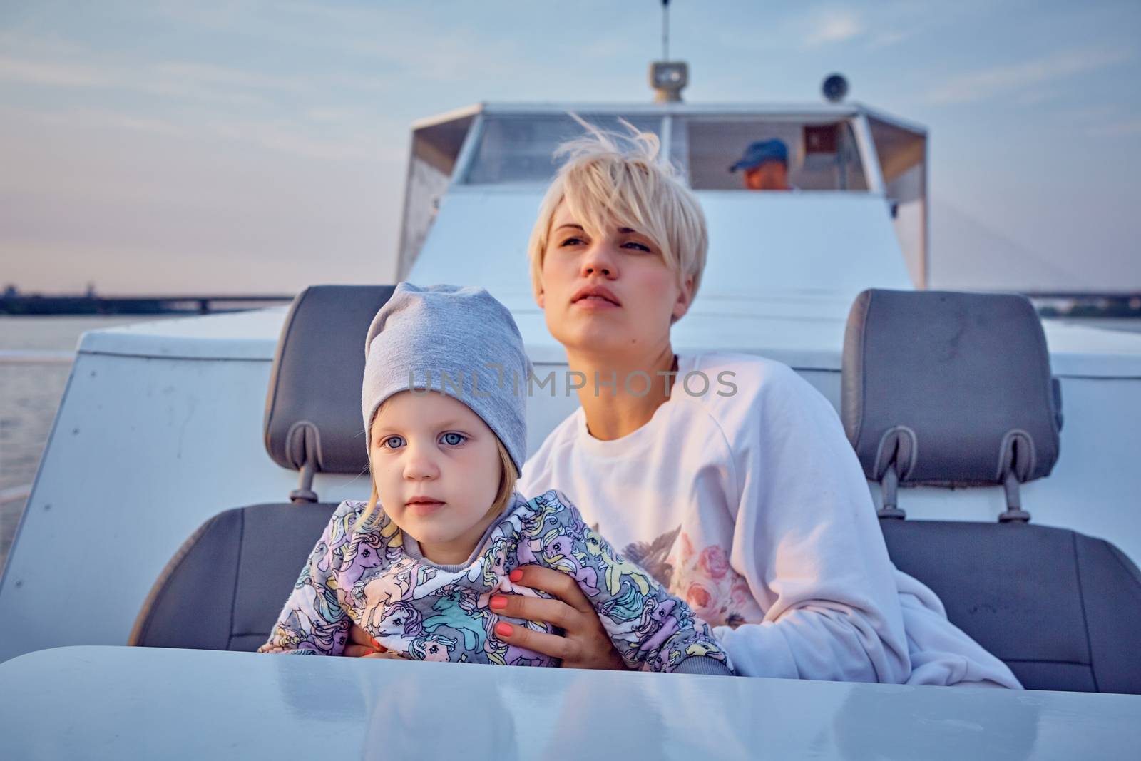 Mother, daughter on yacht or catamaran boat by sarymsakov