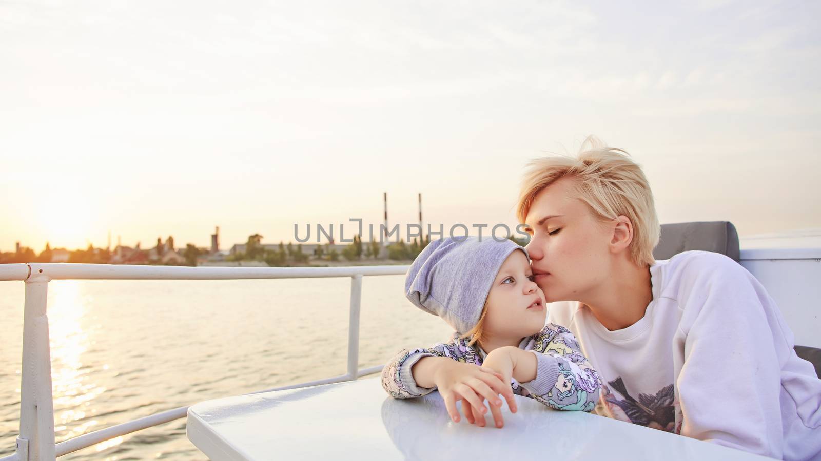 Mother, daughter on yacht or catamaran boat.  Concept of the family