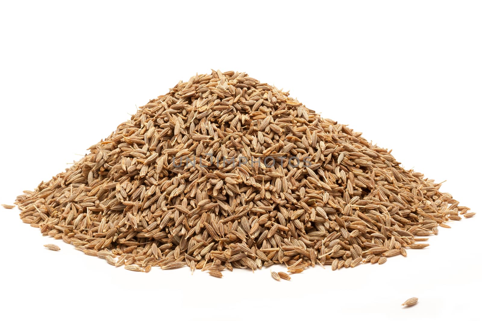 Pile of Organic Cumin seed (Cuminum cyminum) isolated on white background.