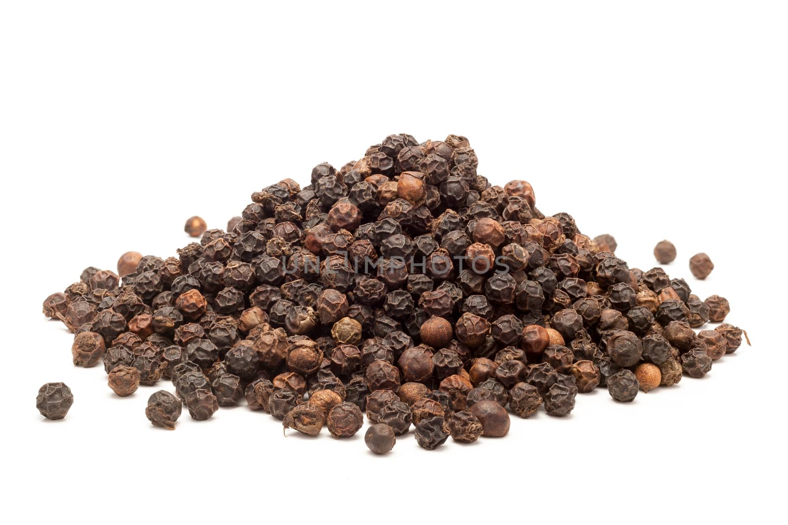 Pile of Organic Black pepper (Piper nigrum) isolated on white background.