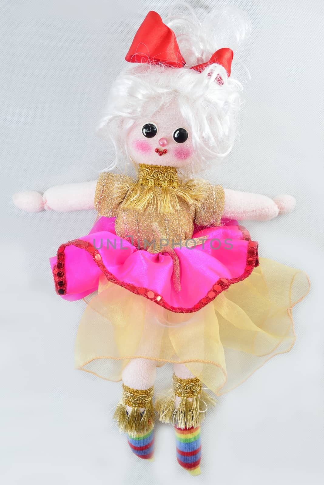 pretty girl's doll standing over white