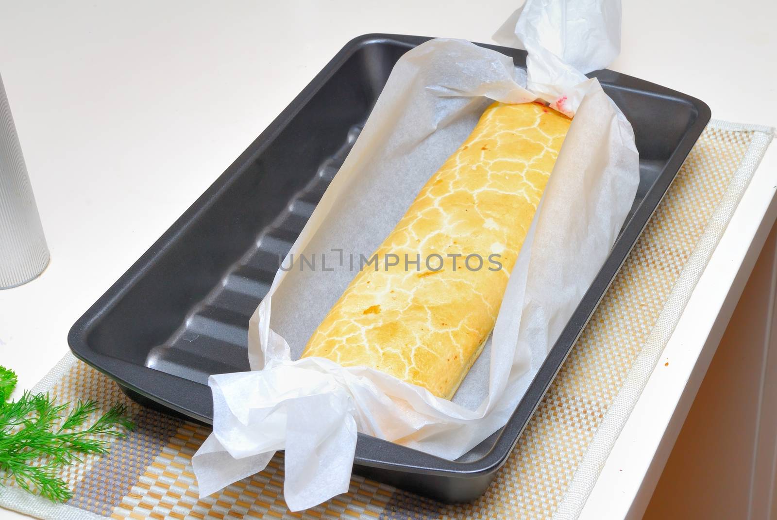 baking Swiss roll (cake) in oven with parchment