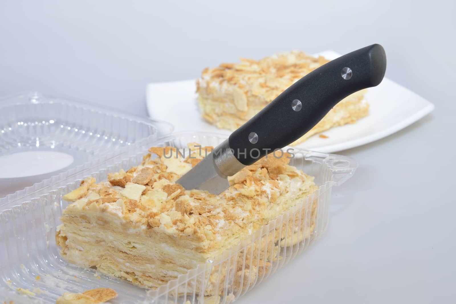 cutting cake in transparent box (blister) from supermarket