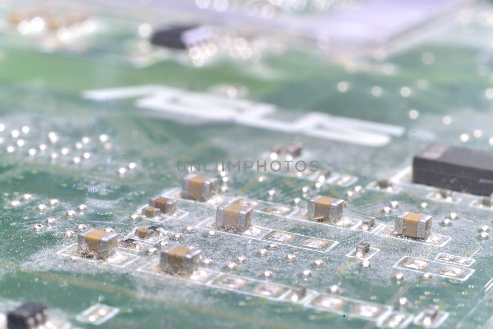 macro zoomed green integrated circuit background (inside computer)