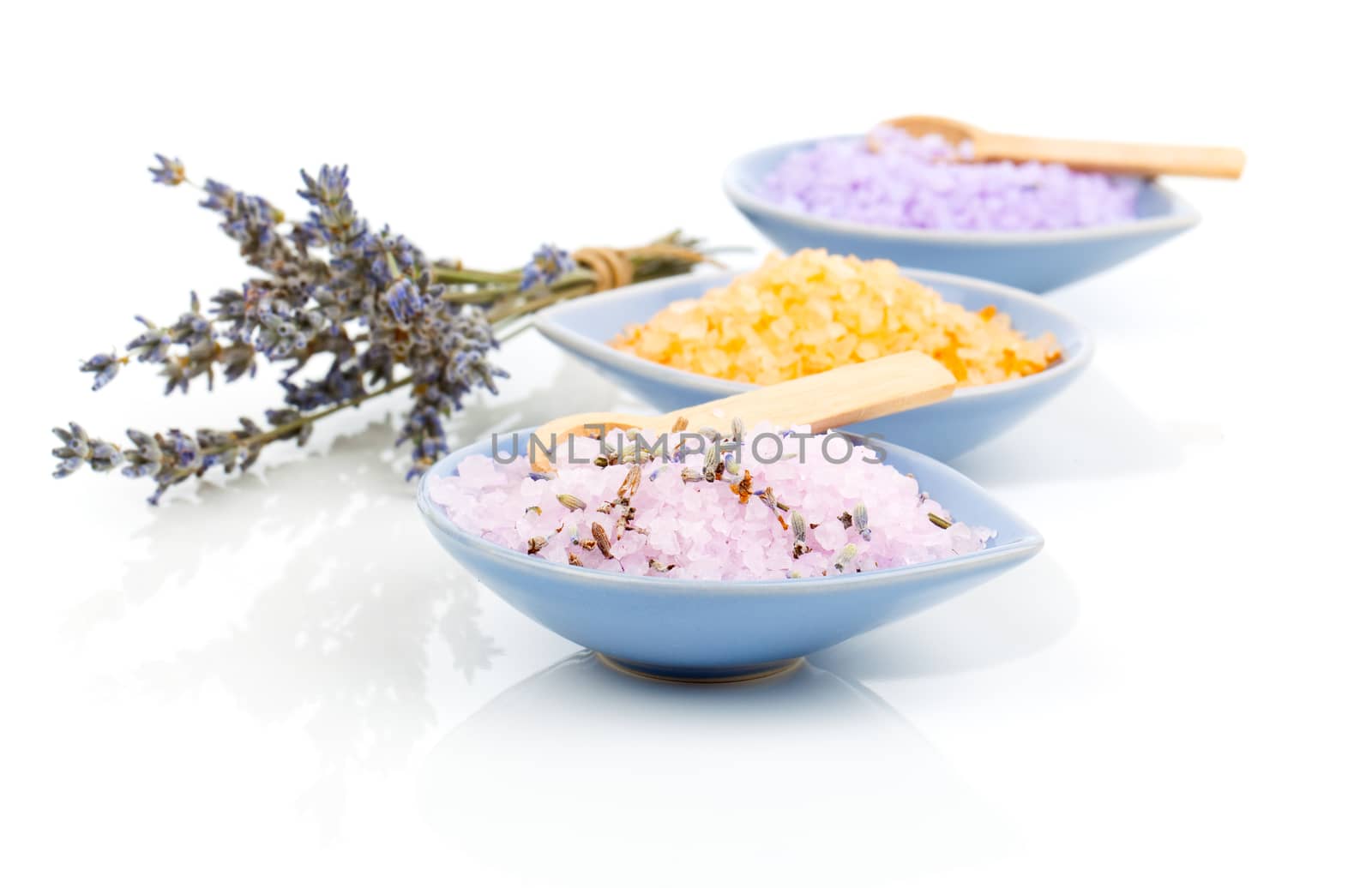 Various types of spa sea salt in bowl,  on a white background