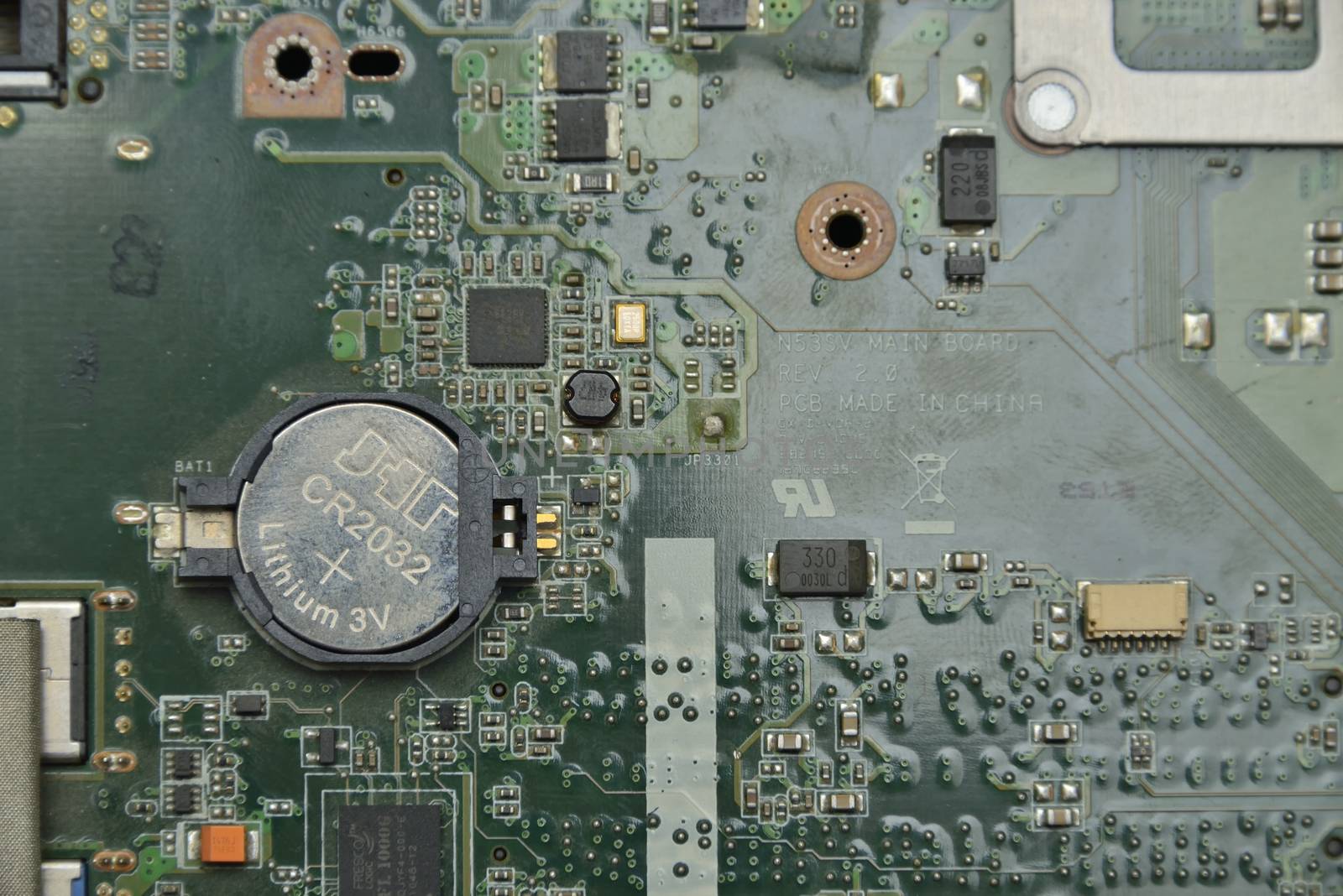 battery on  motherboard (mainboard) with chips, sockets, controllers