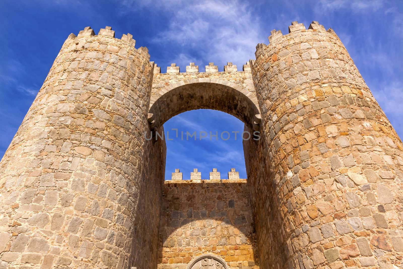 Castle Town Walls Arch Gate Avila Castile Spain.  Described as the most 16th century town in Spain. Public walls, not private.   Walls created in 1088 after Christians conquer and take the city from the Moors  
