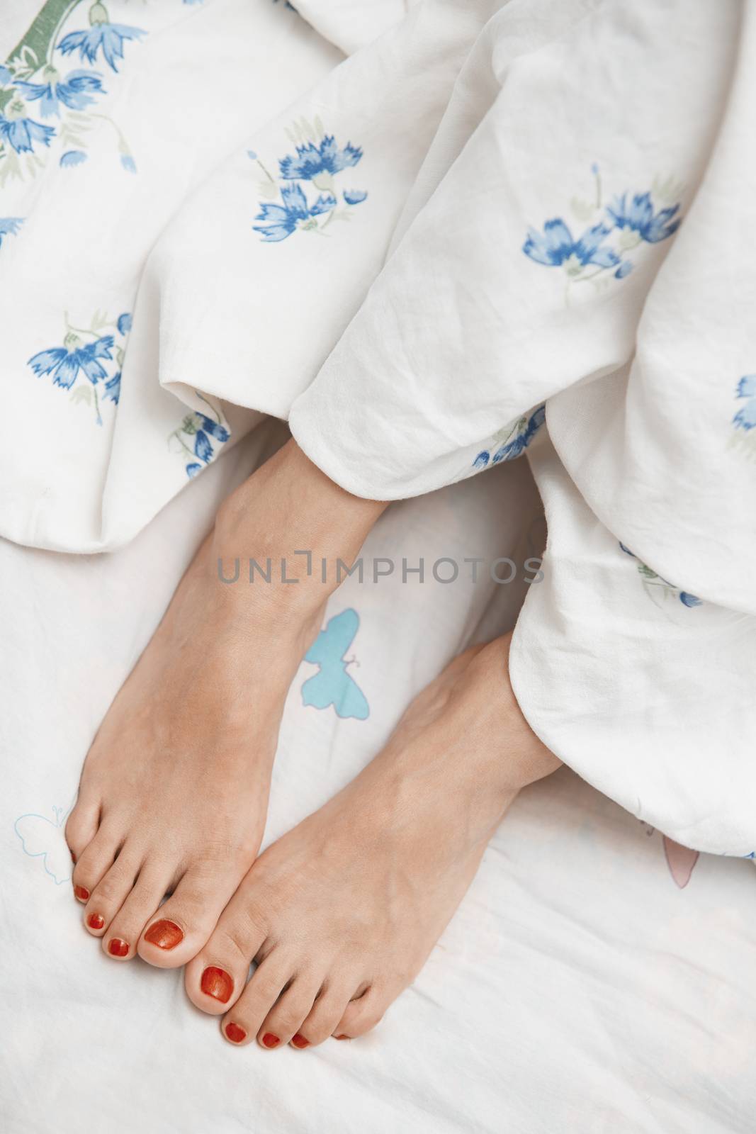 Feet of woman. Vertical photo