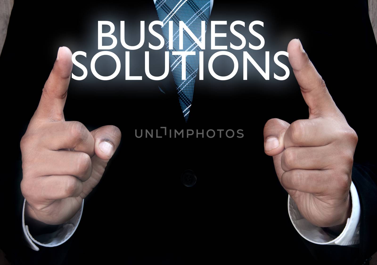 Business man holding solutions in his hands 