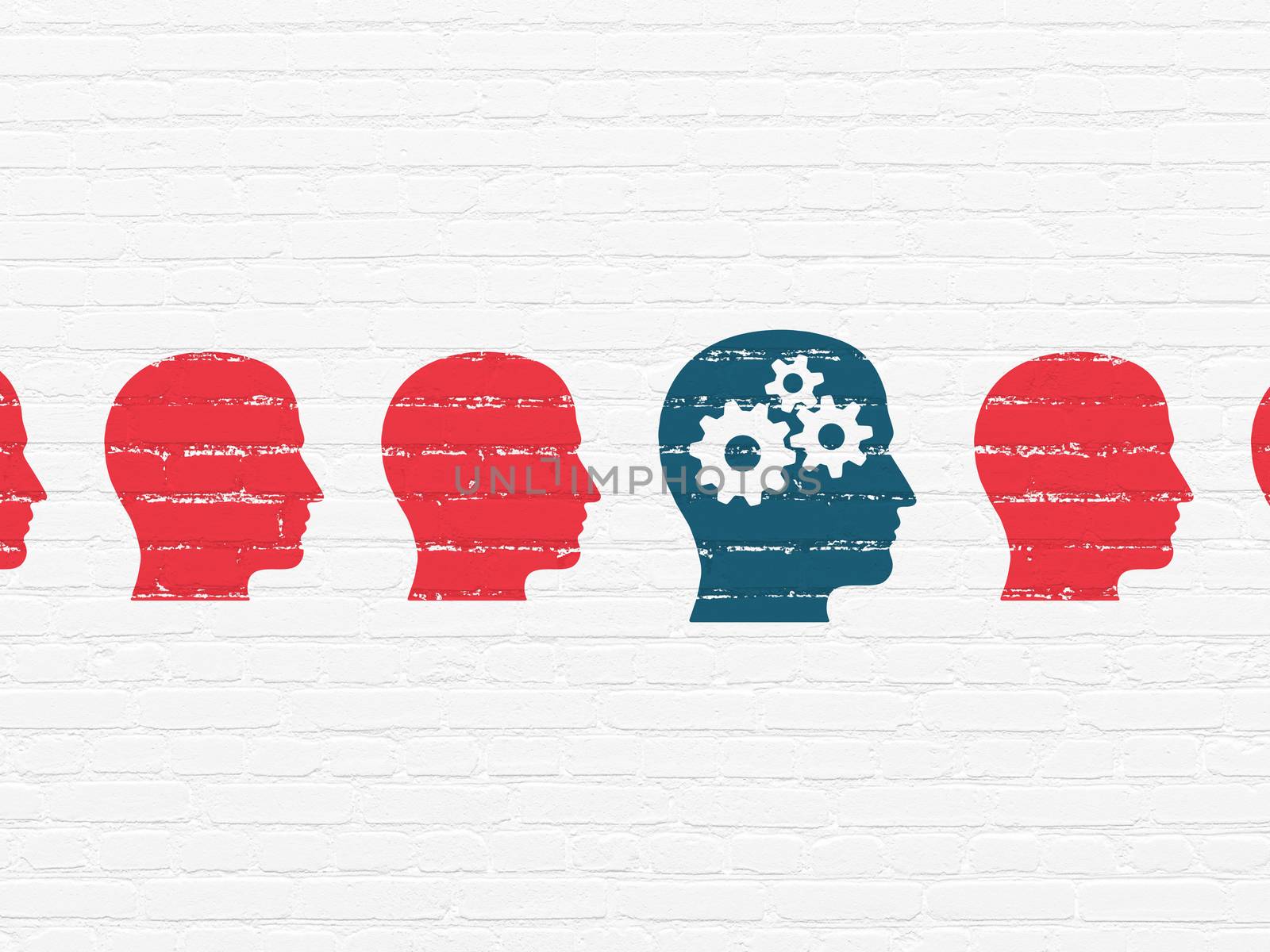 Studying concept: head with gears icon on wall background by maxkabakov