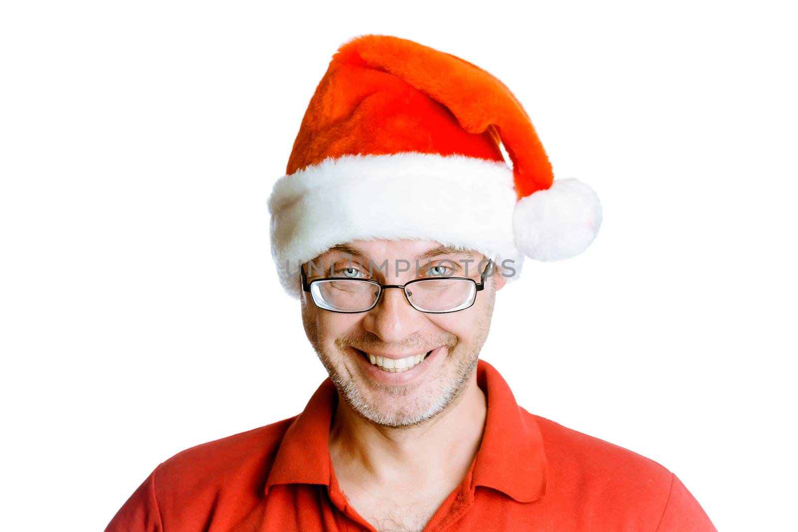 Smiling happy unshaven man on a white background with glasses and a hat Santa