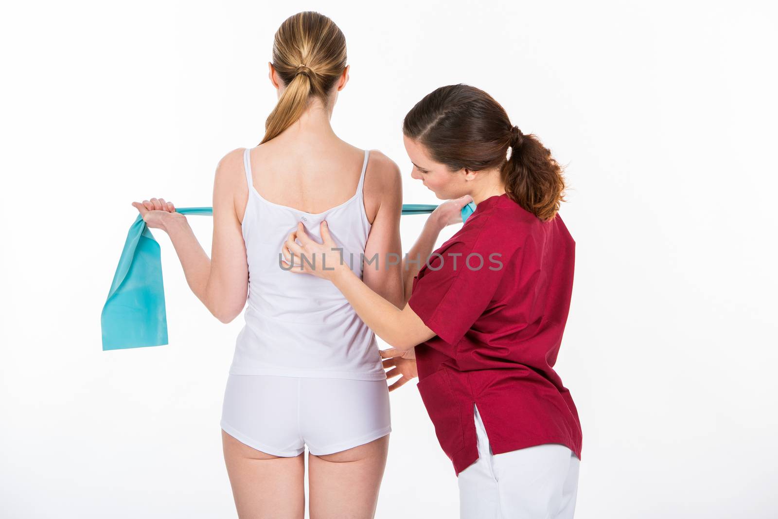 physiotherapist with woman patient by Flareimage