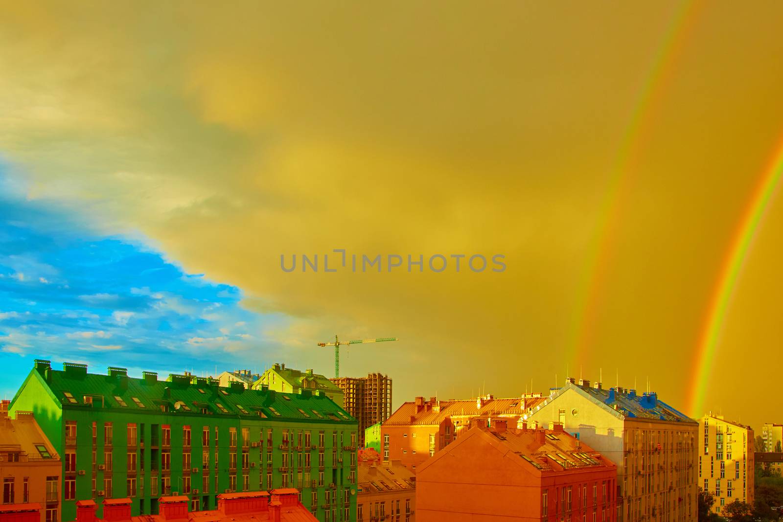 Double rainbow over bright colored houses. Kiev city