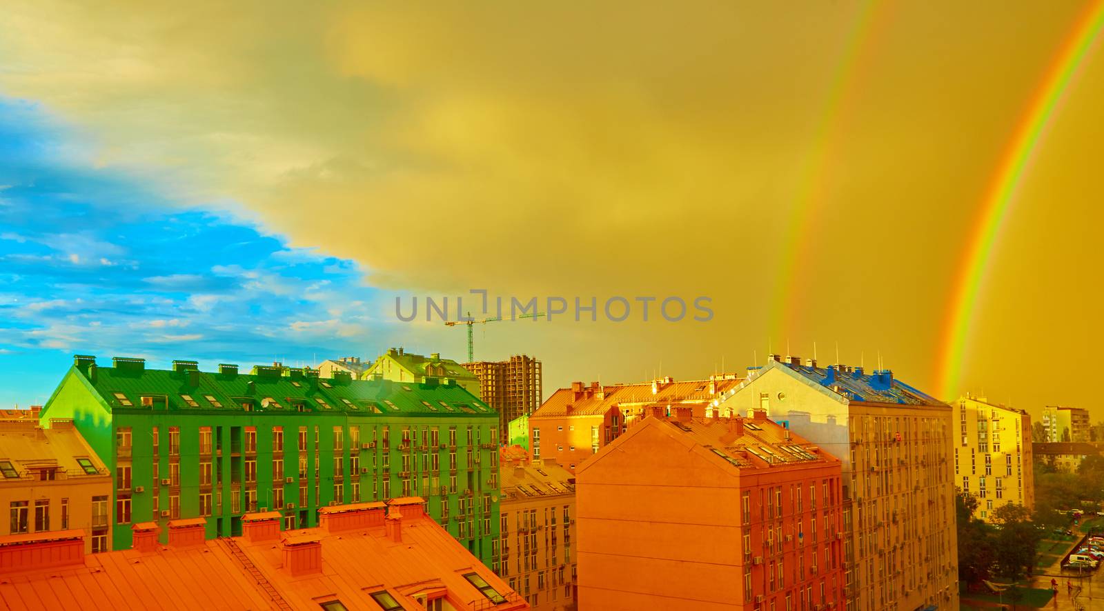 Double rainbow over bright colored houses. Kiev city