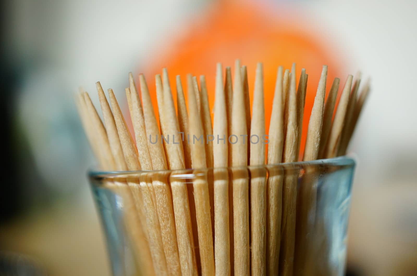 Group of wooden toothpicks in a glass