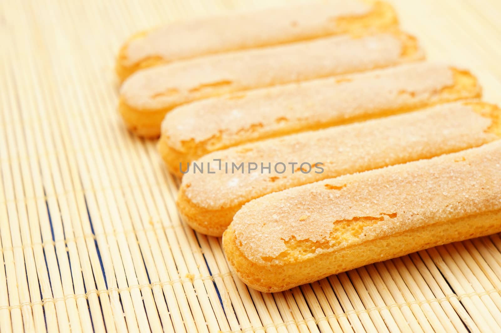 Row of ladyfingers topped with crystal sugar