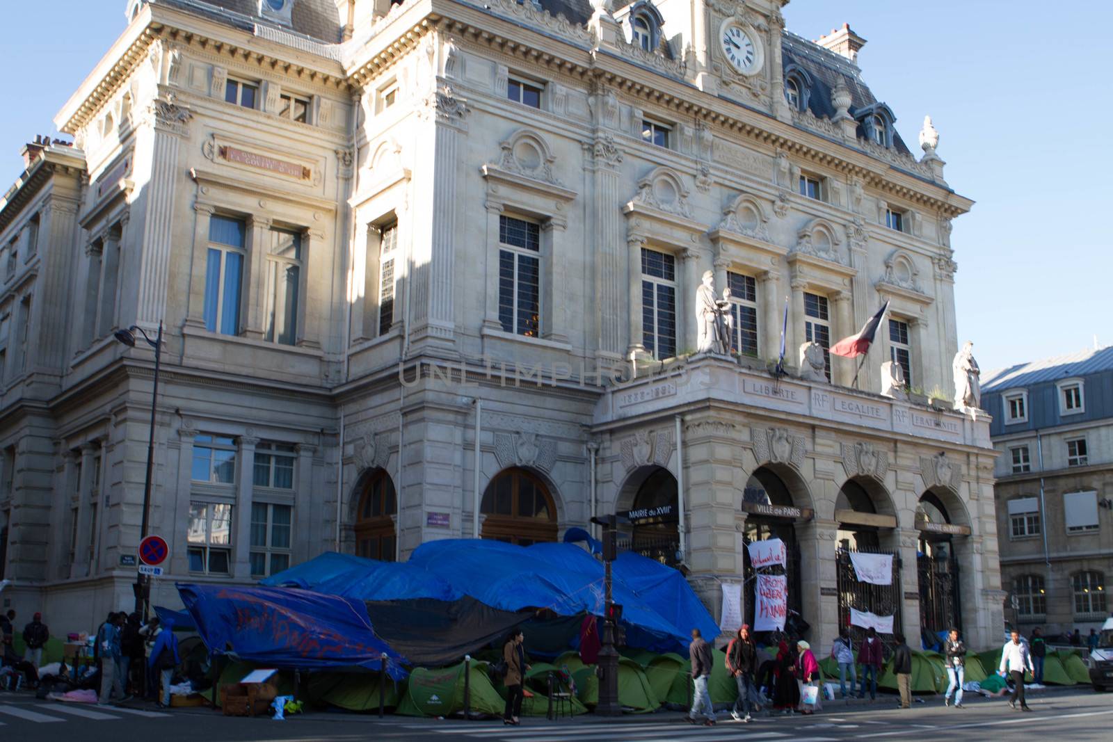 FRANCE, Paris: A refugee camp is installed in front of the city hall of the 18th arrondissement in Paris, on September, 15, 2015. Almost hundred and fifty refugees from South Soudan and Eritrea camp in front of the city hall of the 18th arrondissement in Paris since September, 4, 2015. Paris mayor Anne Hidalgo announced on September, 15, 2015 giving them a place in one of the seven installations opened in the capital and around las week. 