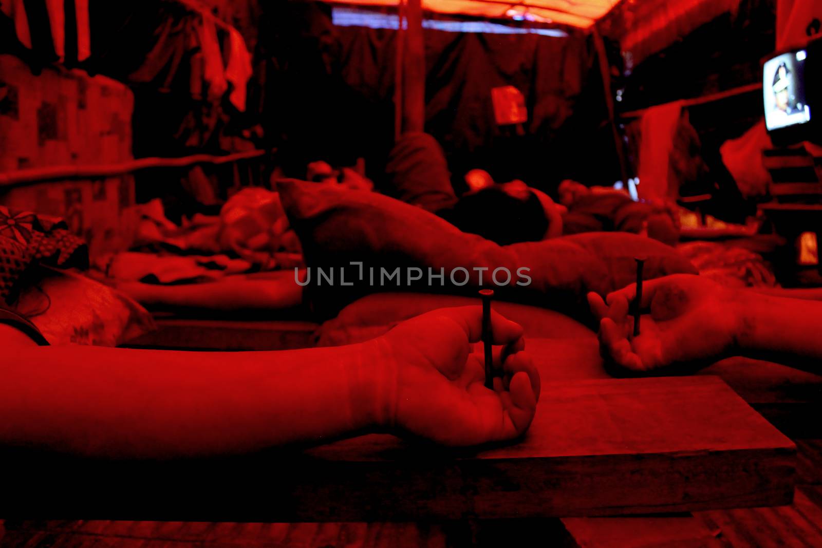 PARAGUAY, Greater Asuncion: 23 bus drivers from the firm Line 49, including one woman, lie crucified in front of the Labor, Employment and Social Security Ministry in Asuncion, on September 14, 2015. 	It has been 76 days since they started to protest after being dismissed by the company. More and more of the protesters have turned to crucifixion during this period to raise awareness of their cause. Some of them have also sewn their lips together on hunger strike. 