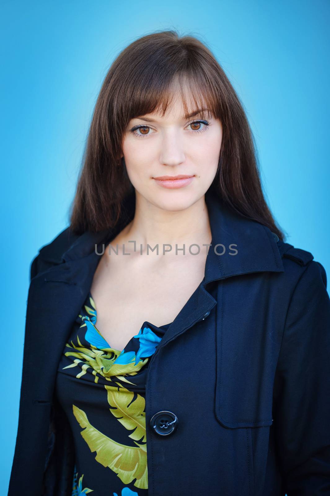 portrait of a beautiful brunette girl on blue background by timonko