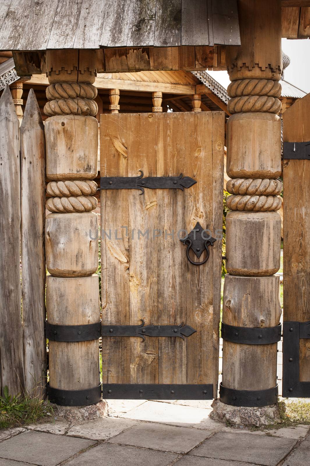 old wooden door on metal hinges